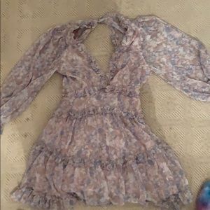 A trendy dress with ruffle hem and a open back